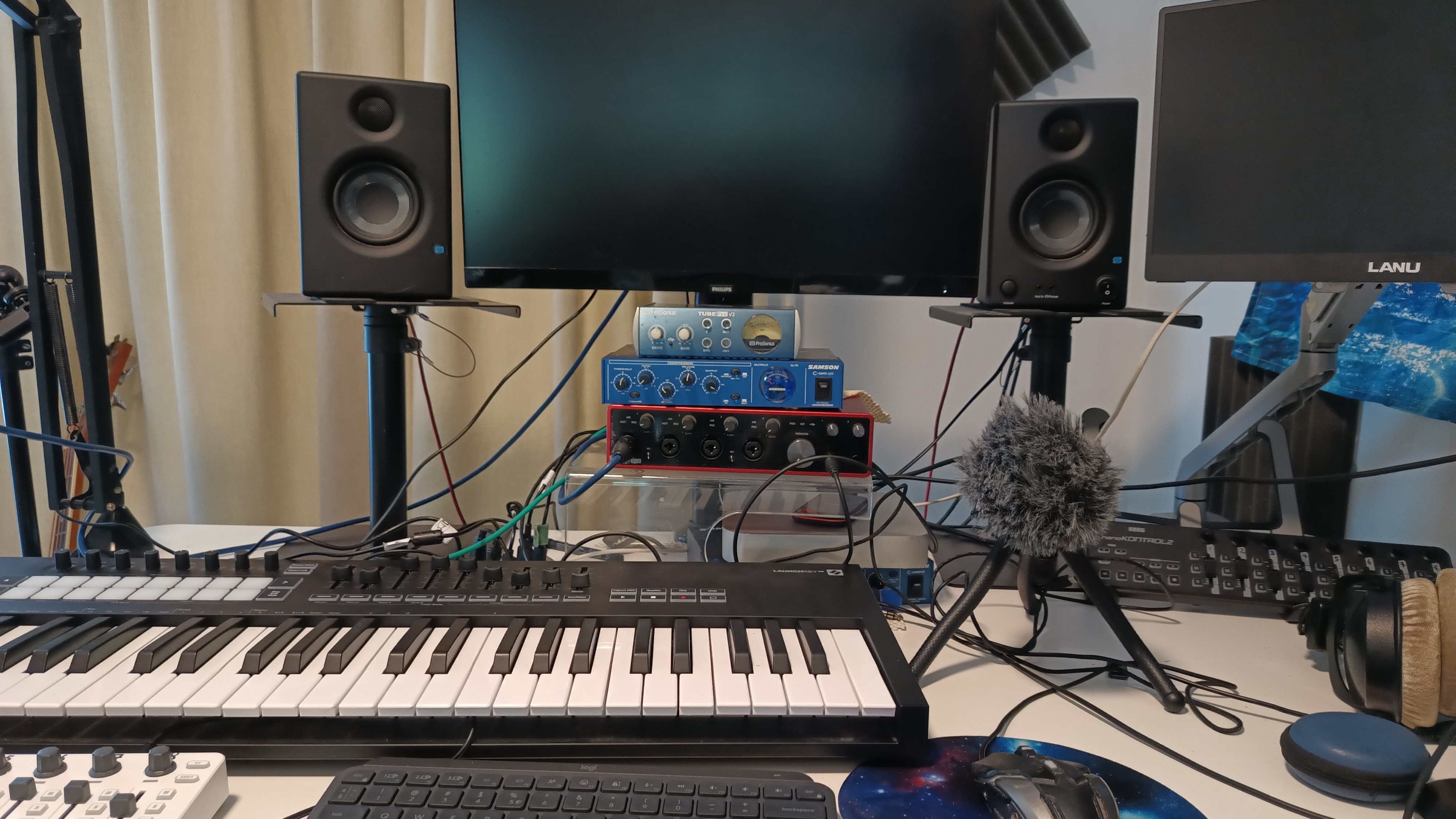 Selecting Frequencies studio setup with keyboard, monitors, speakers and microphones